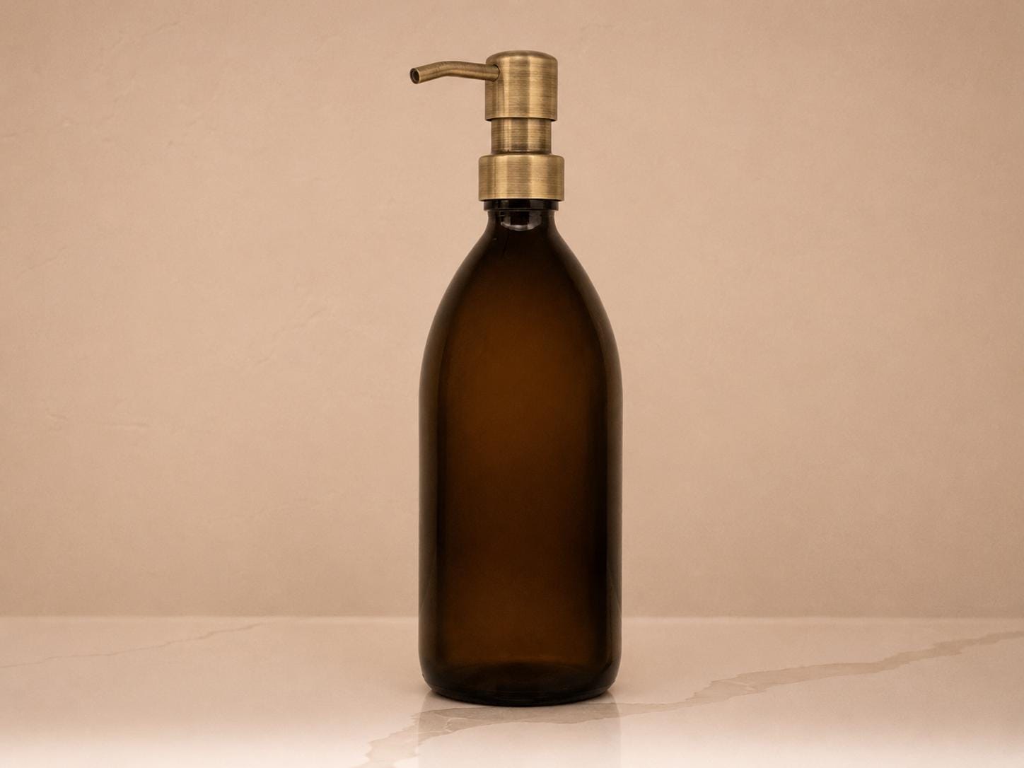 16 oz amber glass bottle with antique brass pump