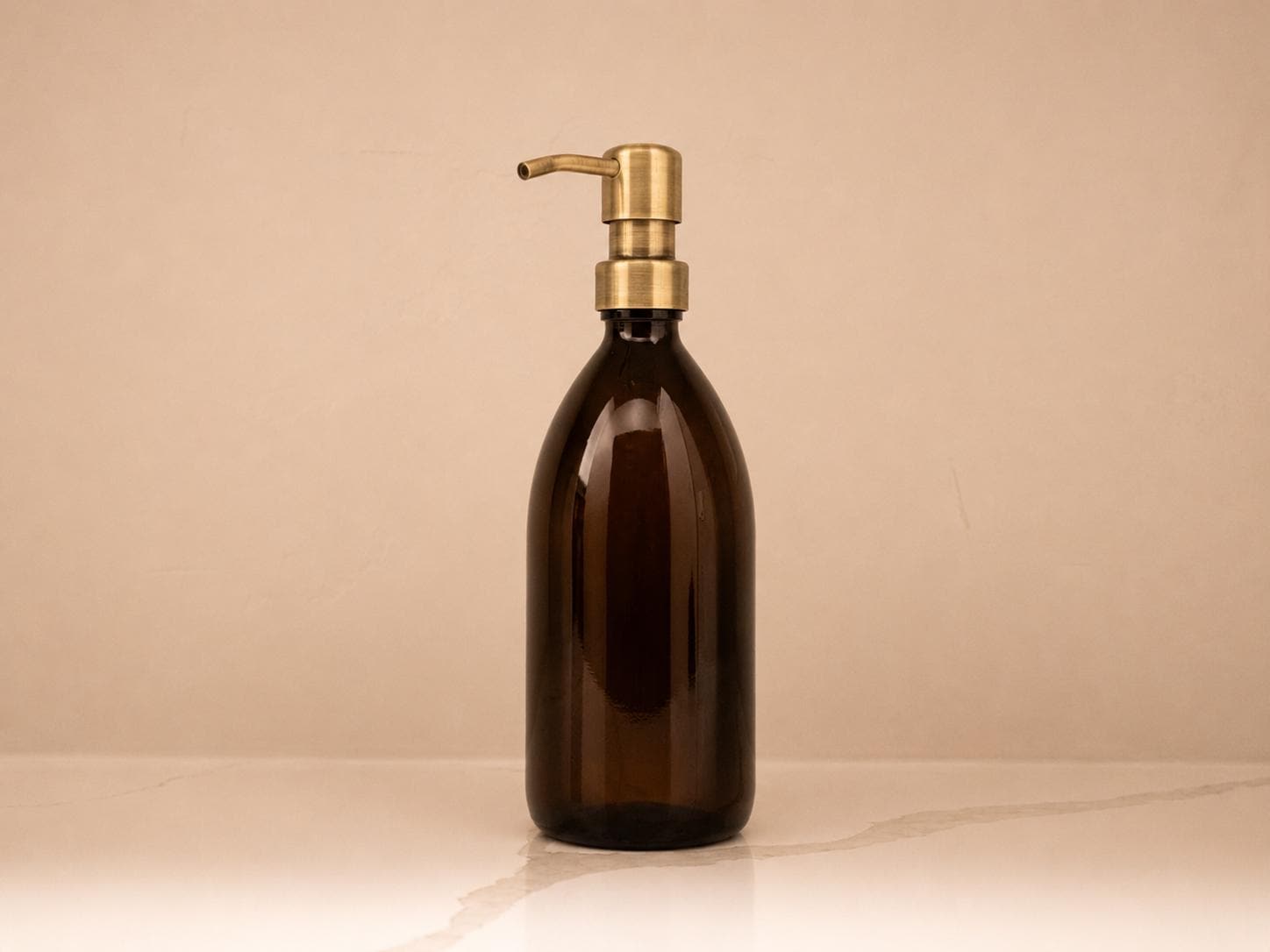 16 oz refillable amber glass bottle, antique brass pump